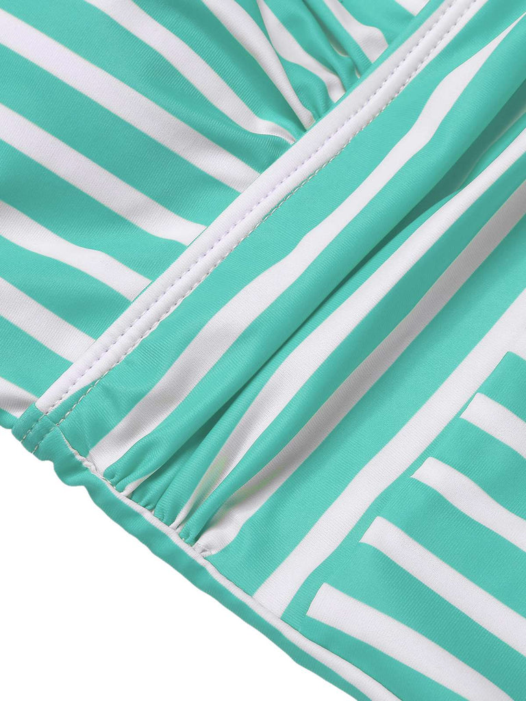 She's wearing 1950s Stripes Spaghetti Strap One-Piece Swimsuit and the whole beach remembers the 1950s