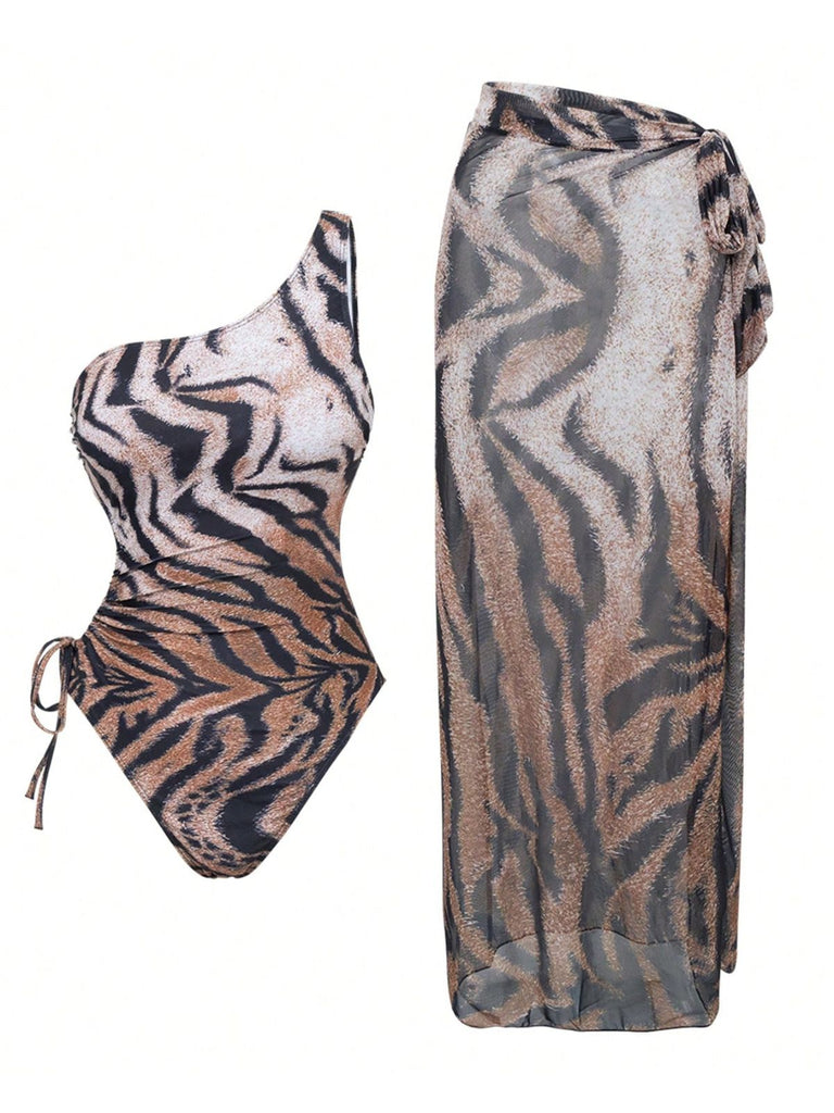 She's wearing 1950s Tiger One-Shoulder Swimsuit & Cover-Up and the whole beach remembers the 1950s