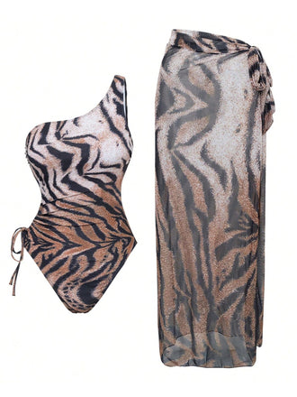 She's wearing 1950s Tiger One-Shoulder Swimsuit & Cover-Up and the whole beach remembers the 1950s