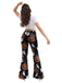 She walks in these 1960s Halloween Pumpkin Ghost Flare Pants and the world follows