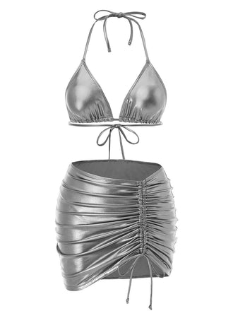 She's wearing 1970s Halter Metallic Bikini & Ruched Cover-Up and the whole beach remembers the 1970s