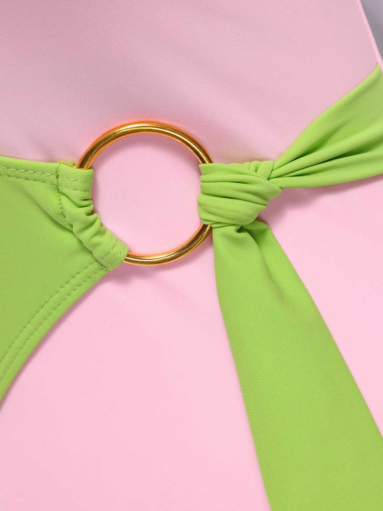 This 1980s Contrast Cross Strap Ring-Tie One-Piece Swimsuit carries 1980s vacation dreams in every stitch