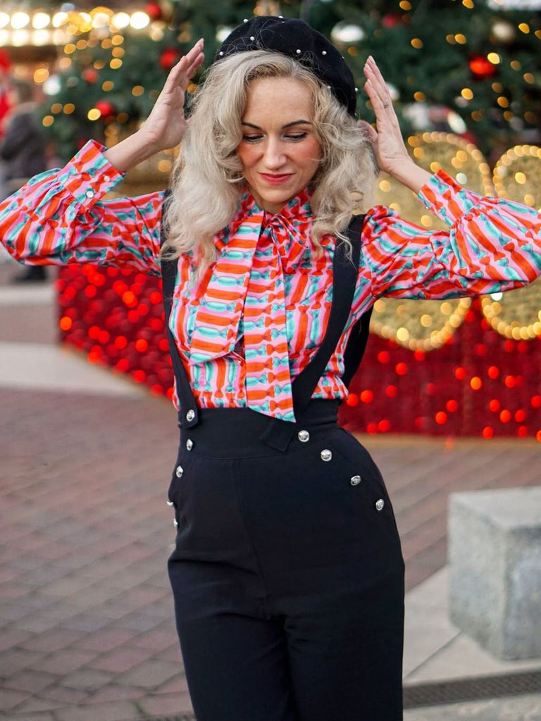 She pairs this 2PCS 1950s Candy Tie-Up Blouse & Black Suspender Pants with confidence and 1950s charm