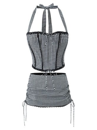 She pairs this 2PCS 1950s Gingham Plaid Lace-Up Crop Camisole & Skirt with confidence and 1950s charm
