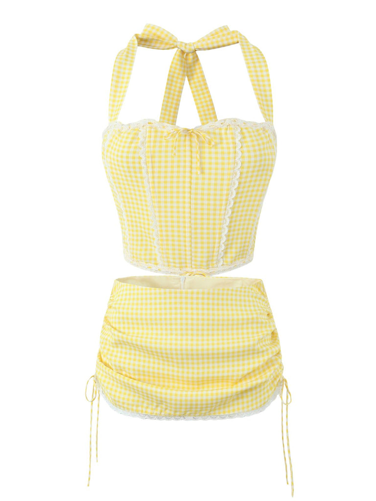 She pairs this 2PCS 1950s Gingham Plaid Lace-Up Crop Camisole & Skirt with confidence and 1950s charm
