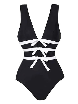 She's wearing 2PCS Black 1940s Bow One-Piece Swimsuit & Swim Skirt and the whole beach remembers the 1940s