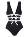 She's wearing 2PCS Black 1940s Bow One-Piece Swimsuit & Swim Skirt and the whole beach remembers the 1940s