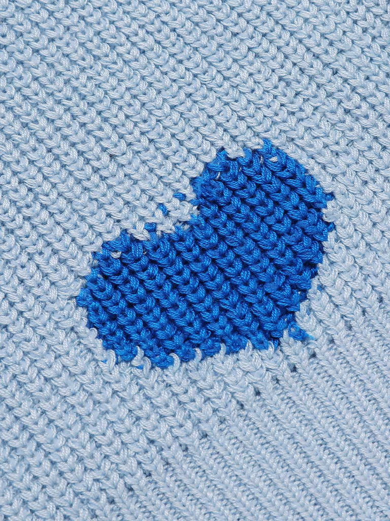 She pairs this 2PCS Blue 1960s Knitted Heart Cropped Top & Skirt with confidence and 1960s charm