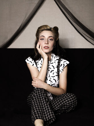 She pairs this 2PCS White Blouse Top & Suspender Pants with confidence and vintage charm