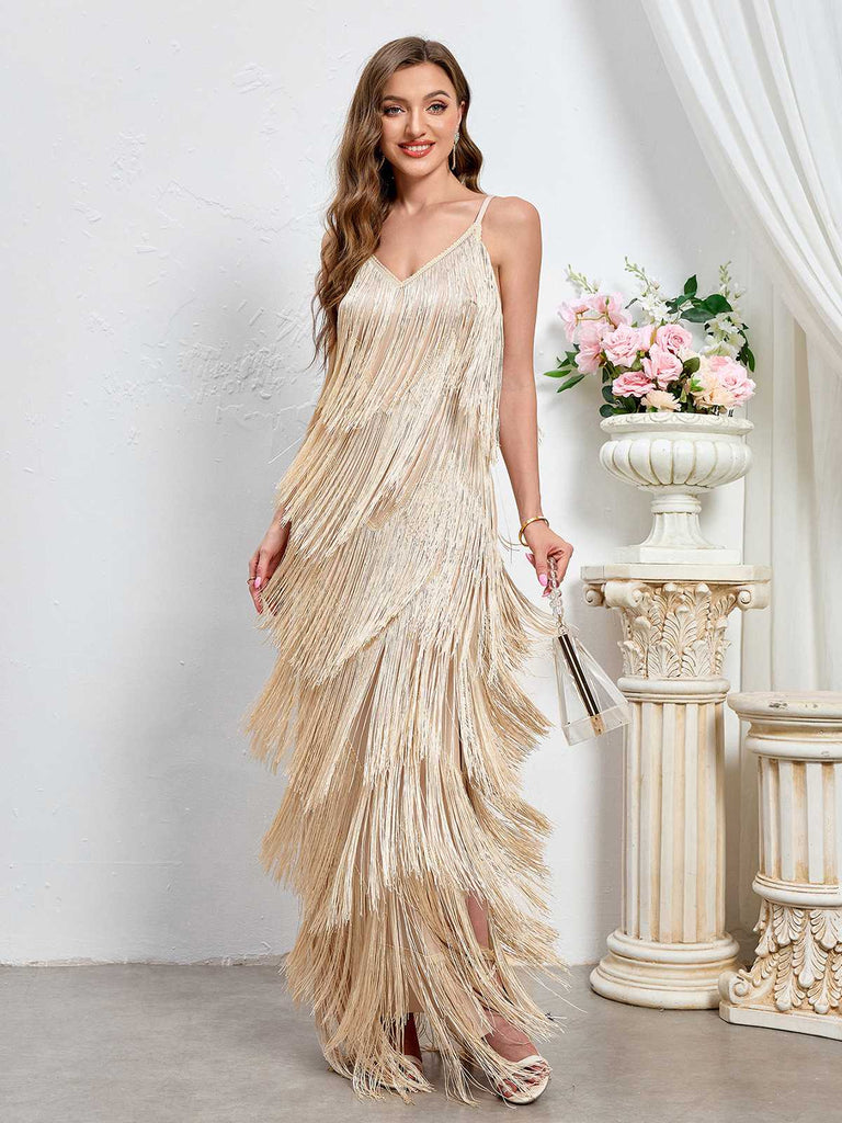 She slips into this Beige 1920s Tassel Spaghetti Straps Maxi Dress and suddenly it's a 1920s daydream