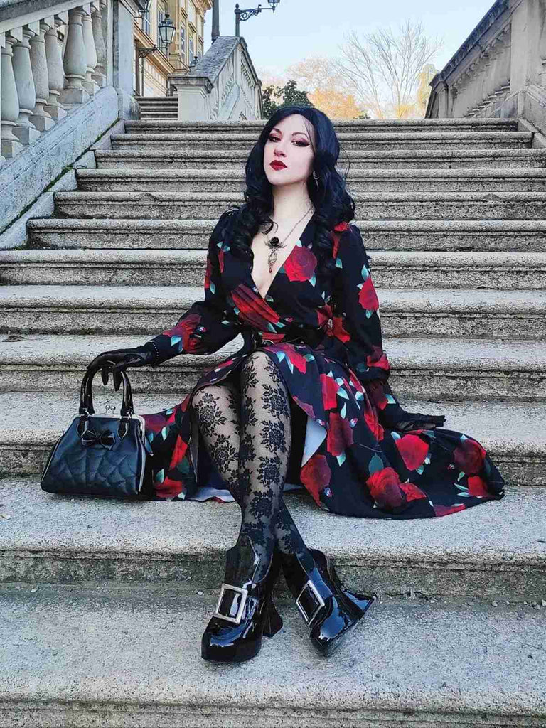 She slips into this Black 1940s Rose Lantern Sleeved Lace-Up Dress and suddenly it's a 1940s daydream