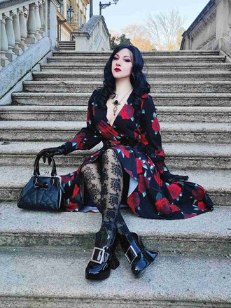 She slips into this Black 1940s Rose Lantern Sleeved Lace-Up Dress and suddenly it's a 1940s daydream