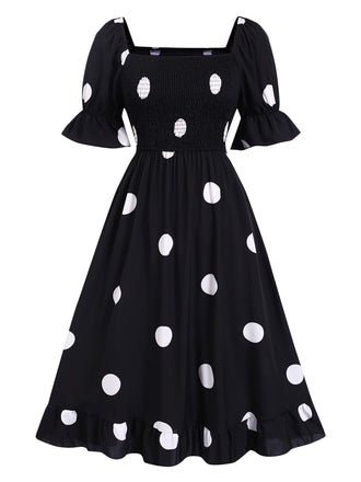 She slips into this Black 1940s Ruffle Cuffs Polka Dots Smocked Dress and suddenly it's a 1940s daydream
