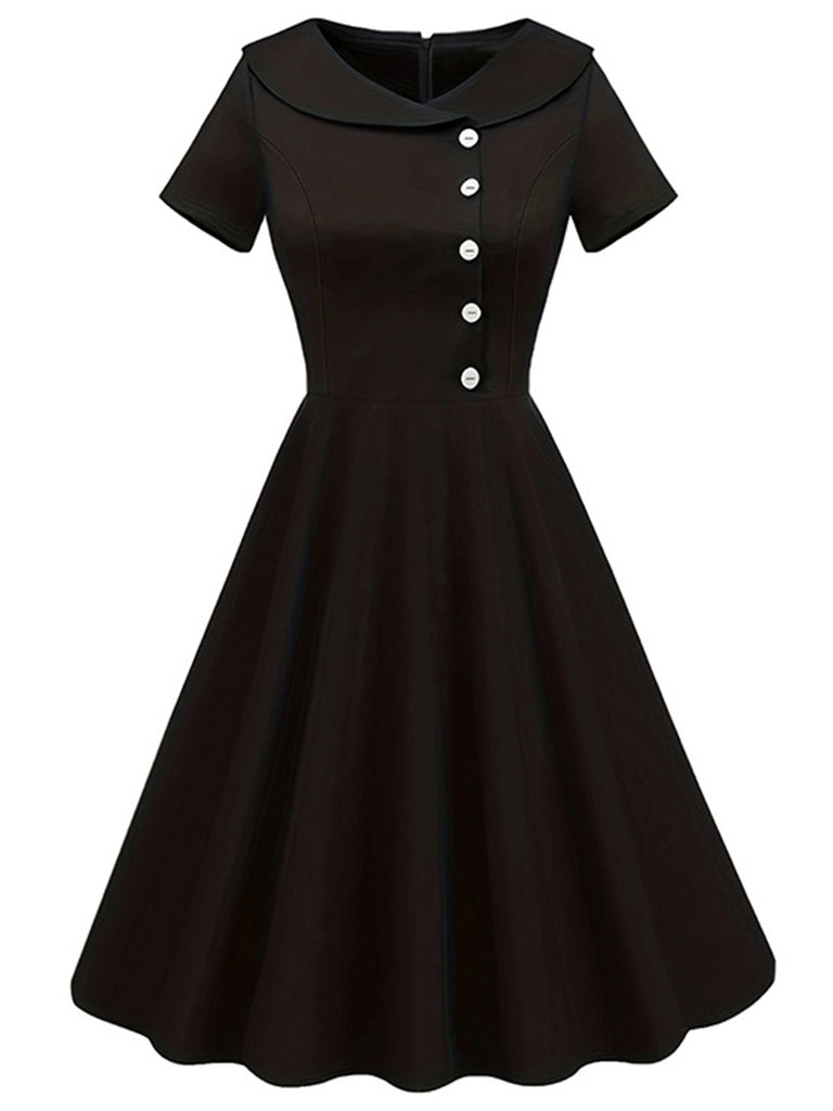 She slips into this Black 1940s Solid Buttoned Lapel Dress and suddenly it's a 1940s daydream