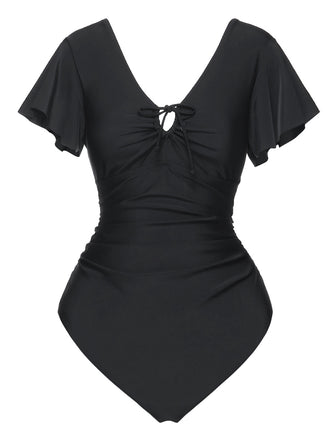 She's wearing Black 1940s Solid Ruffle Sleeves One-Piece Swimsuit and the whole beach remembers the 1940s