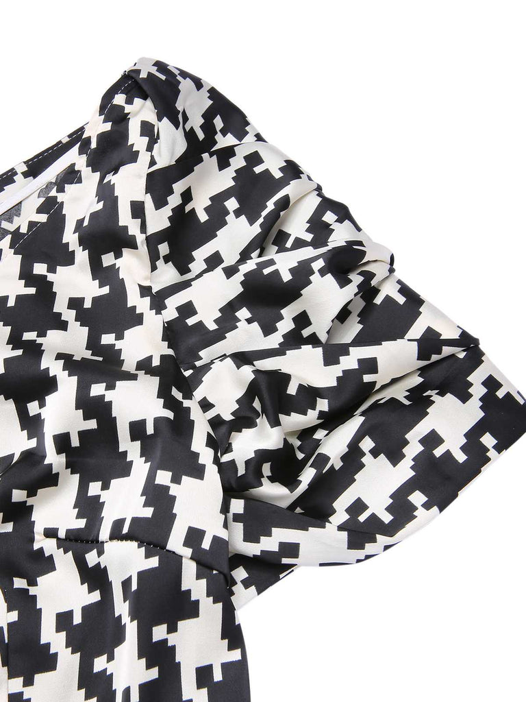 Black 1950s Houndstooth Short Sleeve Belted Dress — vintage elegance for the modern woman