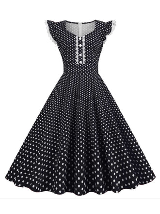 She slips into this Black 1950s Polka Dots Ruffles Dress and suddenly it's a 1950s daydream