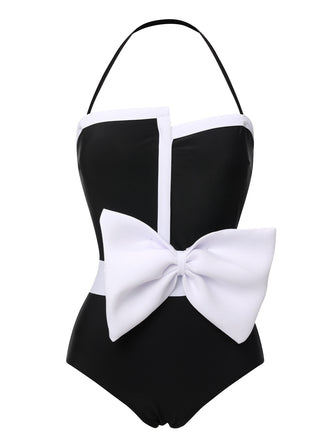 She's wearing Black 1960s Halter Bow Colorblock Swimsuit and the whole beach remembers the 1960s