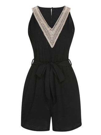 She adds this Black 1960s V-Neck Belted Romper and suddenly it's 1960s perfection