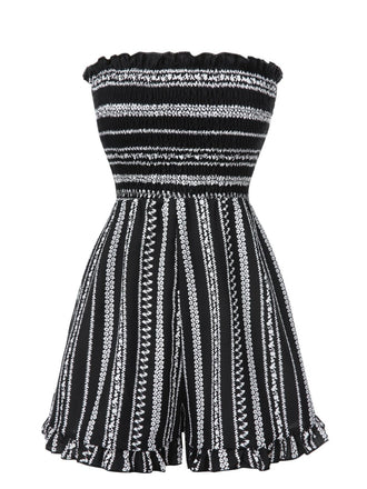 She finds her 1970s story in this Black 1970s Boho Striped Strapless Romper
