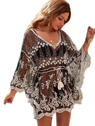 She finds her 1970s story in this Black 1970s Embroidered Mesh Cover-Up
