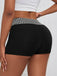 Black 1970s Houndstooth Patchwork Tight Shorts — 1970s style that transcends decades