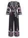 She finds her 1970s story in this Black 1970s Surplice V-Neck Floral Jumpsuit