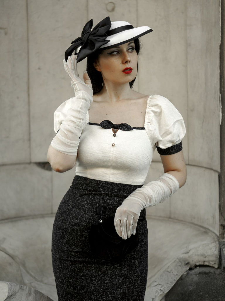 She slips into this Black & Beige 1960s Puff Sleeve Pencil Dress and suddenly it's a 1960s daydream