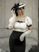 She slips into this Black & Beige 1960s Puff Sleeve Pencil Dress and suddenly it's a 1960s daydream