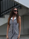 She finds her 1940s story in this Black White 1940s Plaid Lapel Halter Jumpsuit
