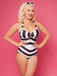 She's wearing Black & White 1950s Barbie Stripes Halter Swimsuit and the whole beach remembers the 1950s