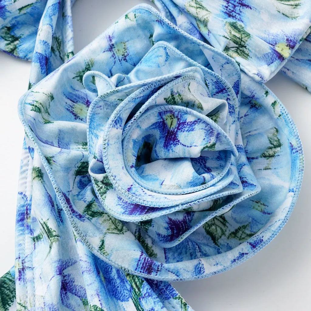 This Blue 1930s Halter Floral Print 3D Rose Swimsuit carries 1930s vacation dreams in every stitch