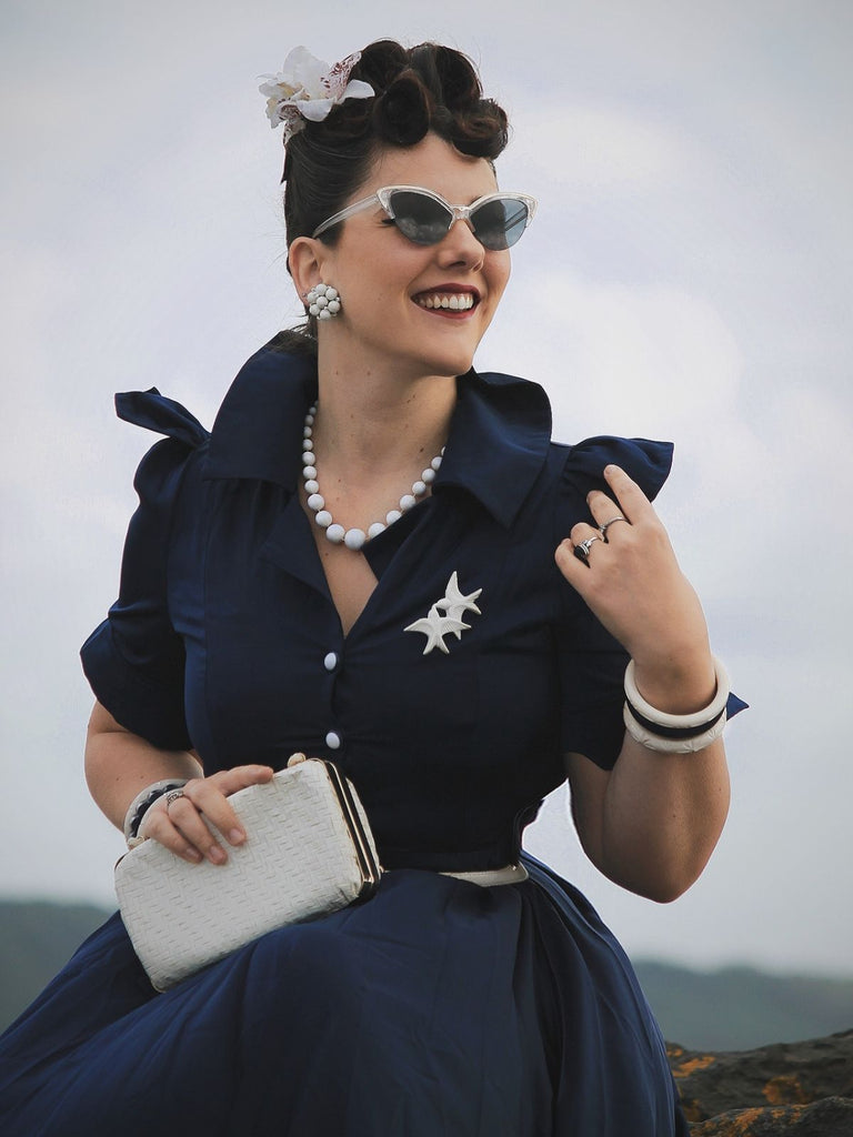She slips into this Blue 1940s Solid Short Sleeves Lapel Dress and suddenly it's a 1940s daydream