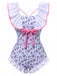She's wearing Blue 1950s Ditsy Floral Bow Ruffled Swimsuit and the whole beach remembers the 1950s
