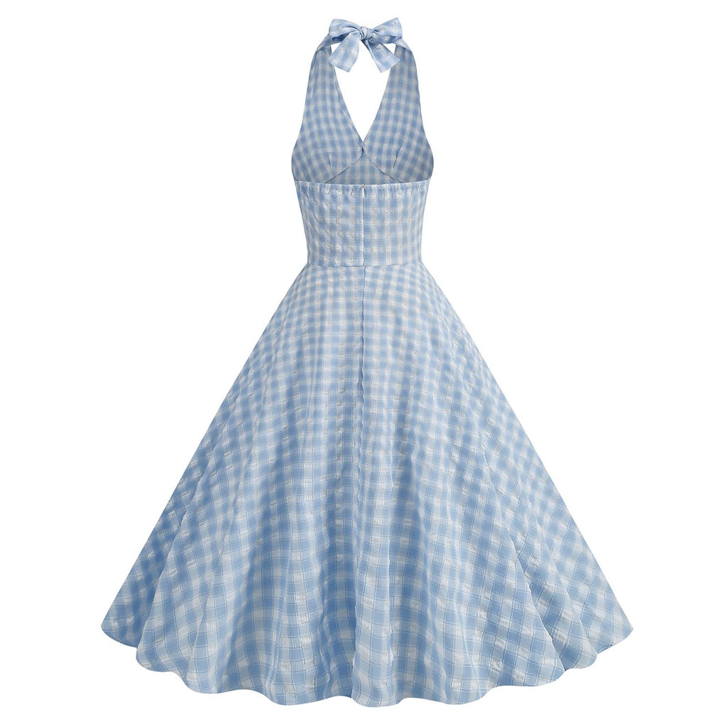 This Blue 1950s Halter Plaid Swing Dress wraps her in 1950s elegance, one twirl at a time