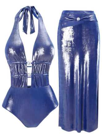 She's wearing Blue 1970s Pearl Shimmery Halter Swimsuit & Cover-Up and the whole beach remembers the 1970s