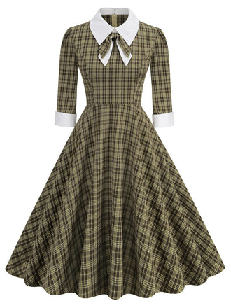 She slips into this Brown 1950s Lapel Bow Decor Plaids Dress and suddenly it's a 1950s daydream