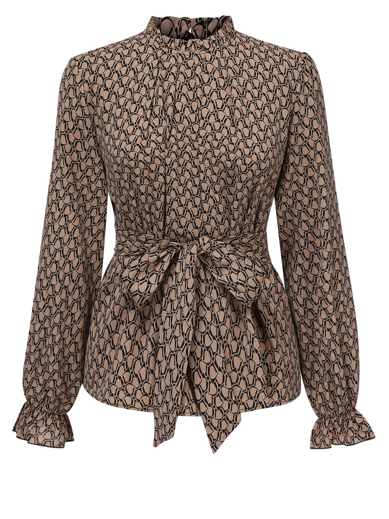 She pairs this Brown 1950s Ruffles Tie Waist Blouse with confidence and 1950s charm