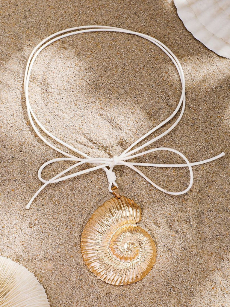 She adds this Conch Starfish Pendant Leather Cord Necklace and suddenly it's vintage perfection