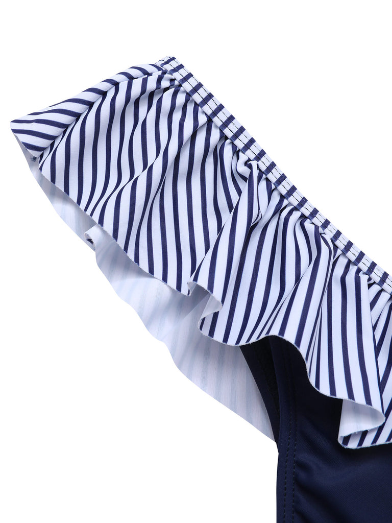 She's wearing Dark Blue 1940s Striped Ruffled Swimsuit and the whole beach remembers the 1940s