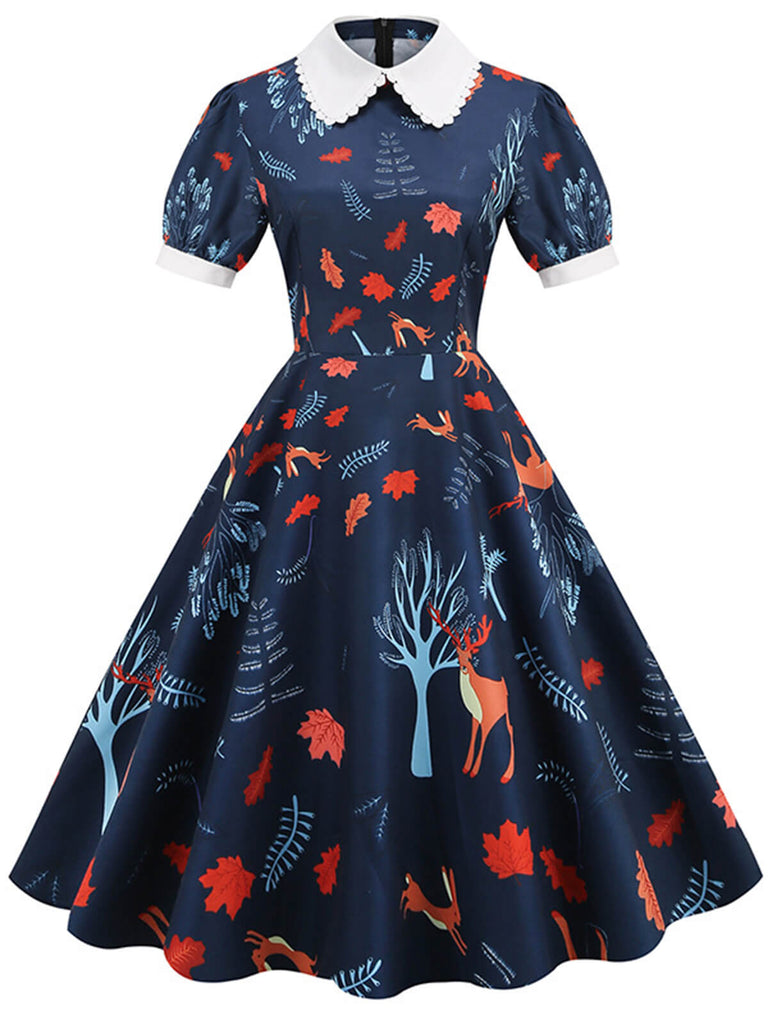 She slips into this Dark Blue 1950s Forest Puff Lapel Dress and suddenly it's a 1950s daydream