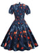 This Dark Blue 1950s Forest Puff Lapel Dress wraps her in 1950s elegance, one twirl at a time