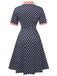 This Dark Blue 1950s Polka Dot Lapel Dress wraps her in 1950s elegance, one twirl at a time