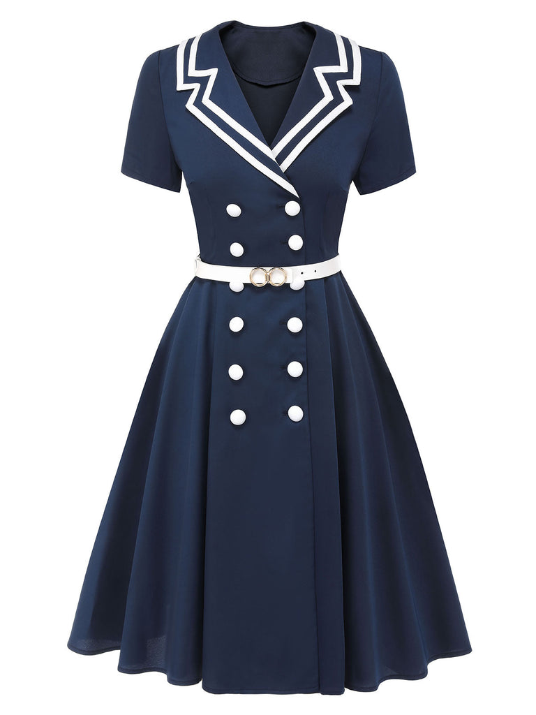 This Dark Blue 1950s Sailor Style Double Breasted Dress wraps her in 1950s elegance, one twirl at a time