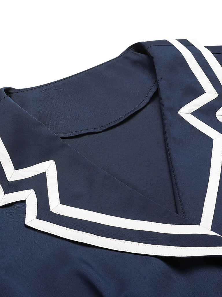 She slips into this Dark Blue 1950s Sailor Style Double Breasted Dress and suddenly it's a 1950s daydream