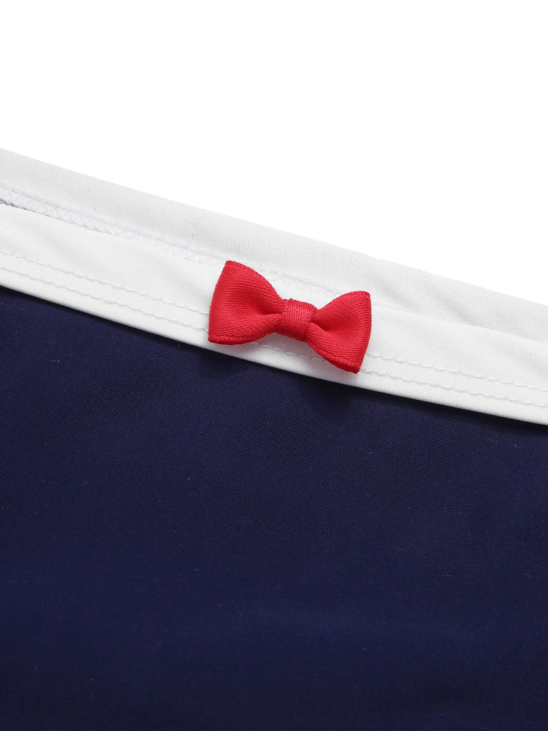 This Dark Blue 1970s Sailor Collar Bow Swimsuit carries 1970s vacation dreams in every stitch