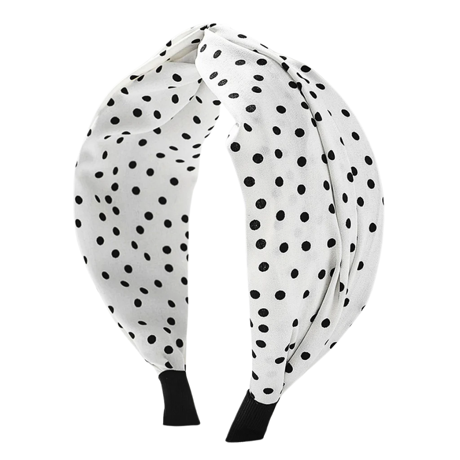 She finds her vintage story in this Fabric Wide Brim Polka Dot Cross Headband