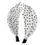 She finds her vintage story in this Fabric Wide Brim Polka Dot Cross Headband