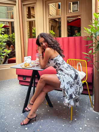 She slips into this Gray 1970s Spaghetti Straps Cowl Neck Newspaper Dress and suddenly it's a 1970s daydream