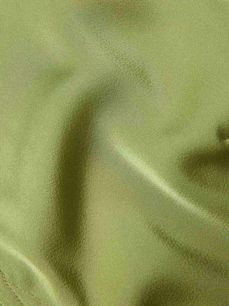She pairs this Green 1940s Satin V-Neck Buttons Shirt with confidence and 1940s charm